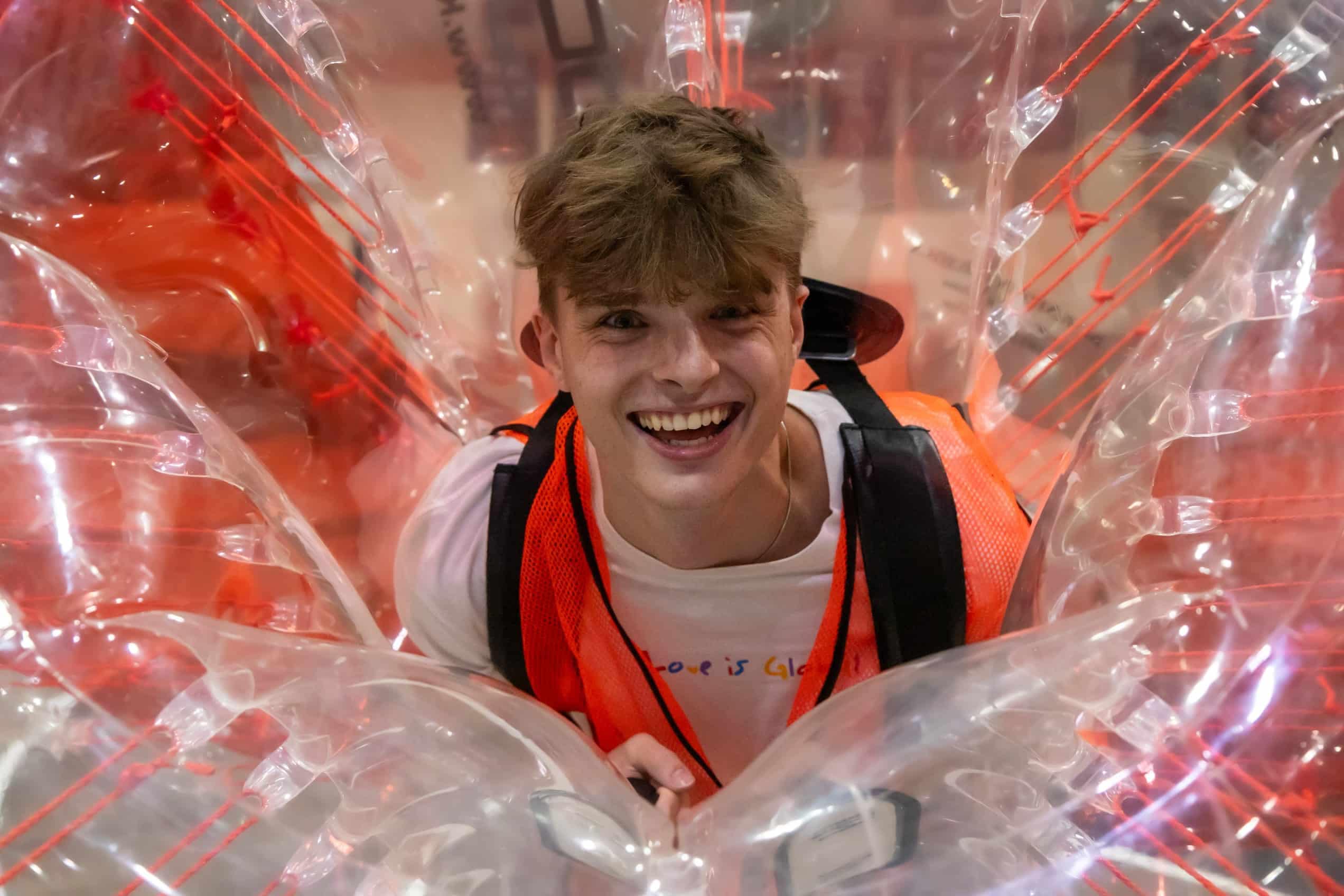Student Smiling playing bubble soccer