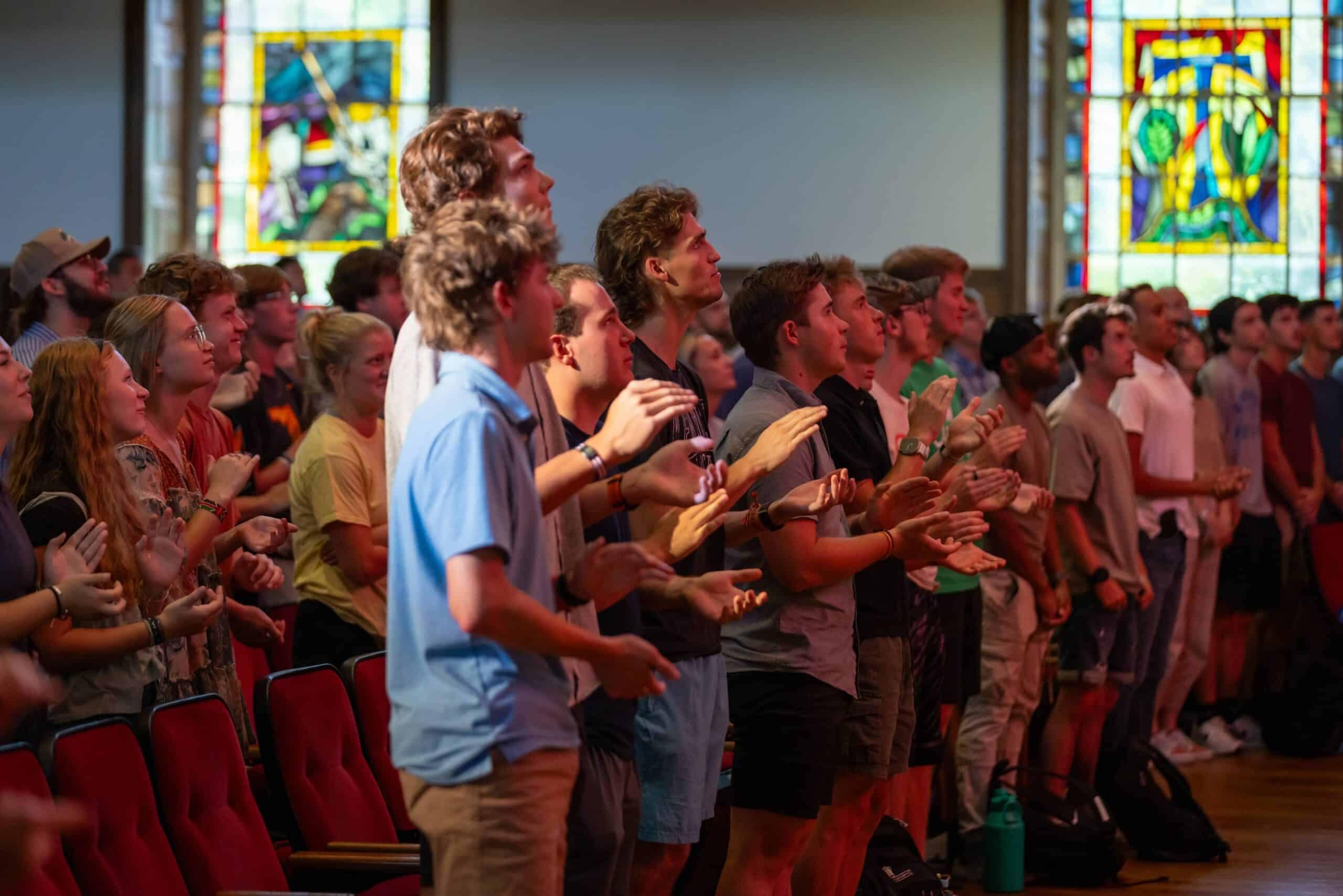 Students clapping at Chapel